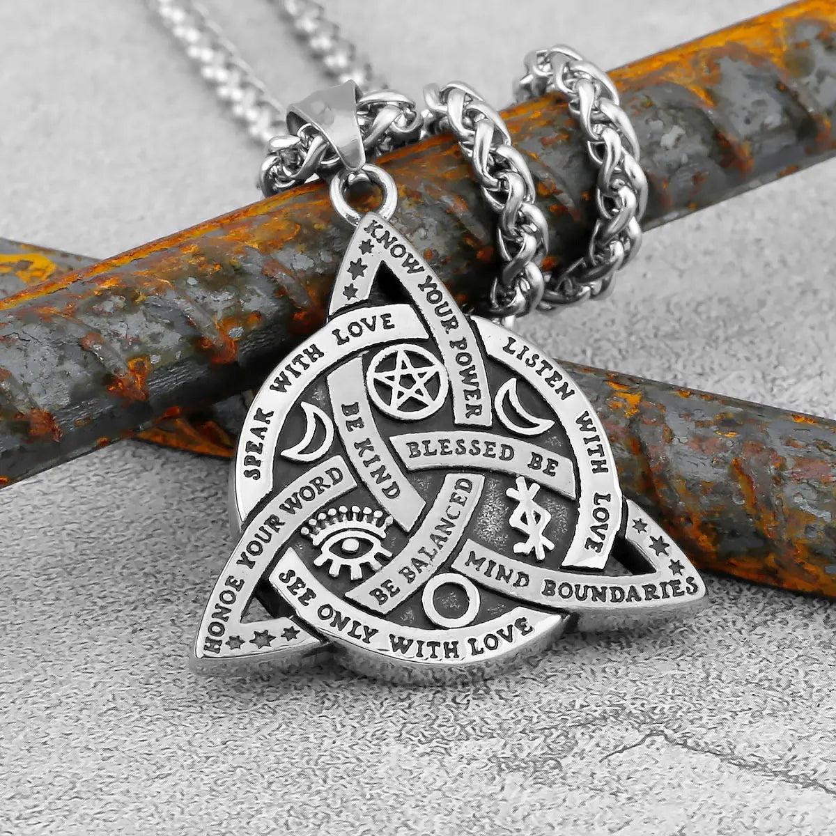 Mystical silver Triquetra Celtic Knot necklace with Wiccan symbols and empowering words, on a durable chain.