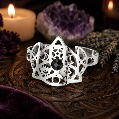 Silver Triquetra Trinity Knot adjustable ring three-quarter view on a Pagan altar