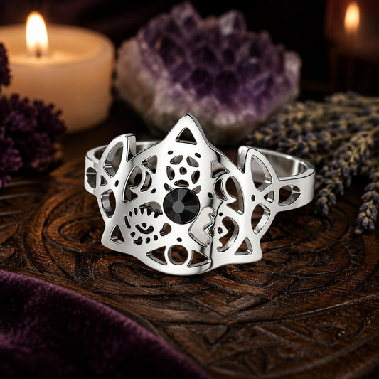 Silver Triquetra Trinity Knot adjustable ring three-quarter view on a Pagan altar