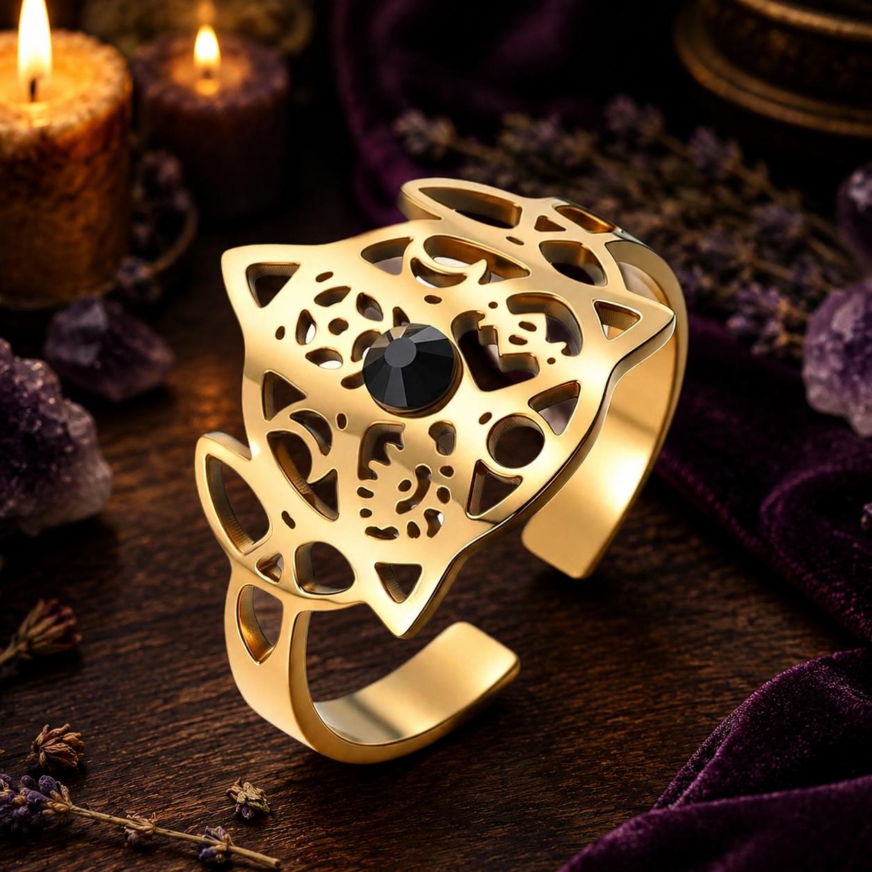 Gold Celtic Knot open ring close-up on a candlelit Pagan altar