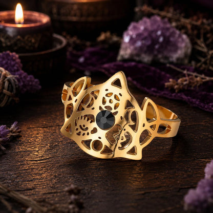 Gold Celtic Knot open ring with black stone in a Pagan altar scene