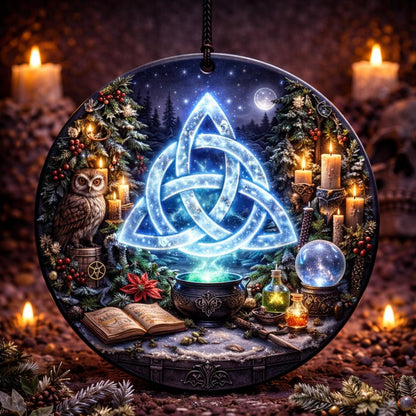 Round ceramic Yule ornament with glowing blue Triquetra, owl, cauldron, candles, and winter forest scene.