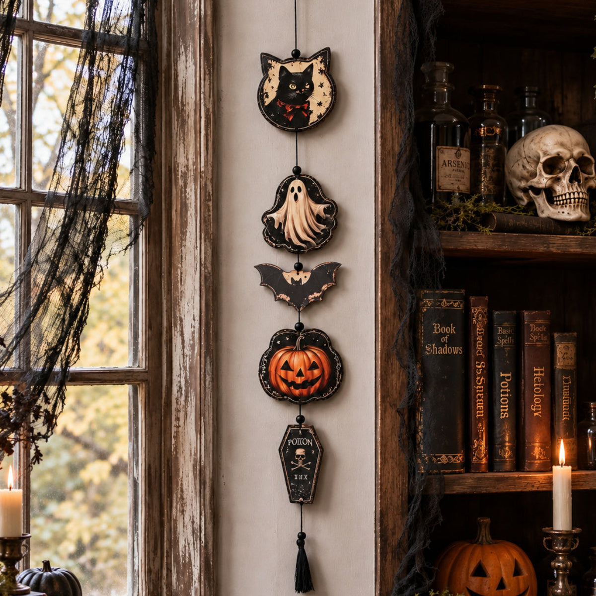 Halloween tassel garland styled above a mantel display
