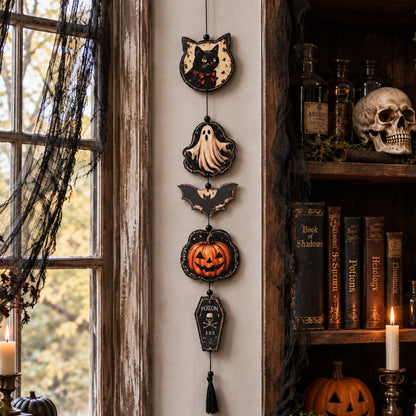 Halloween tassel garland styled above a mantel display