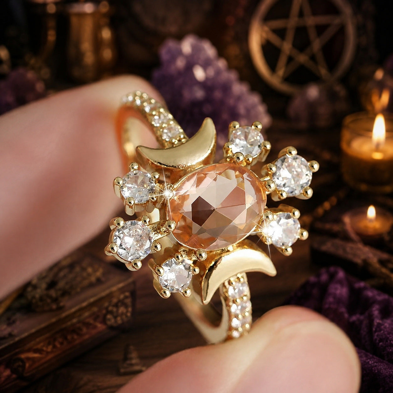 Close-up of Vintage Triple Moon ring with peach stone and clear zircon details