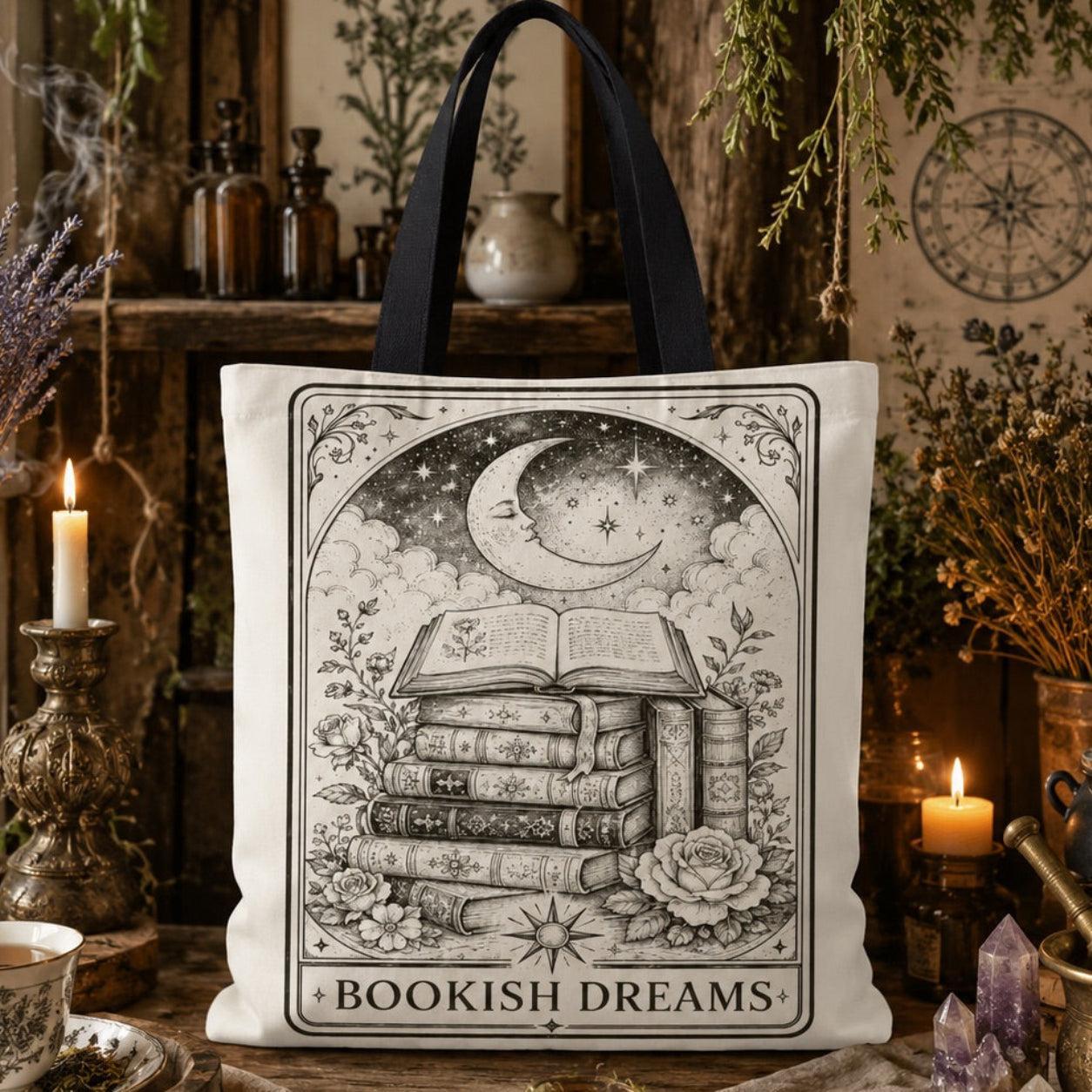 'Bookish Dreams' printed canvas tote bag: a tall stack of books beneath a crescent moon and stars, surrounded by roses.
