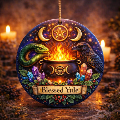 Wicca Yule ceramic ornament with raven, snake, cauldron, crystals, triple moon, and "Blessed Yule" banner.