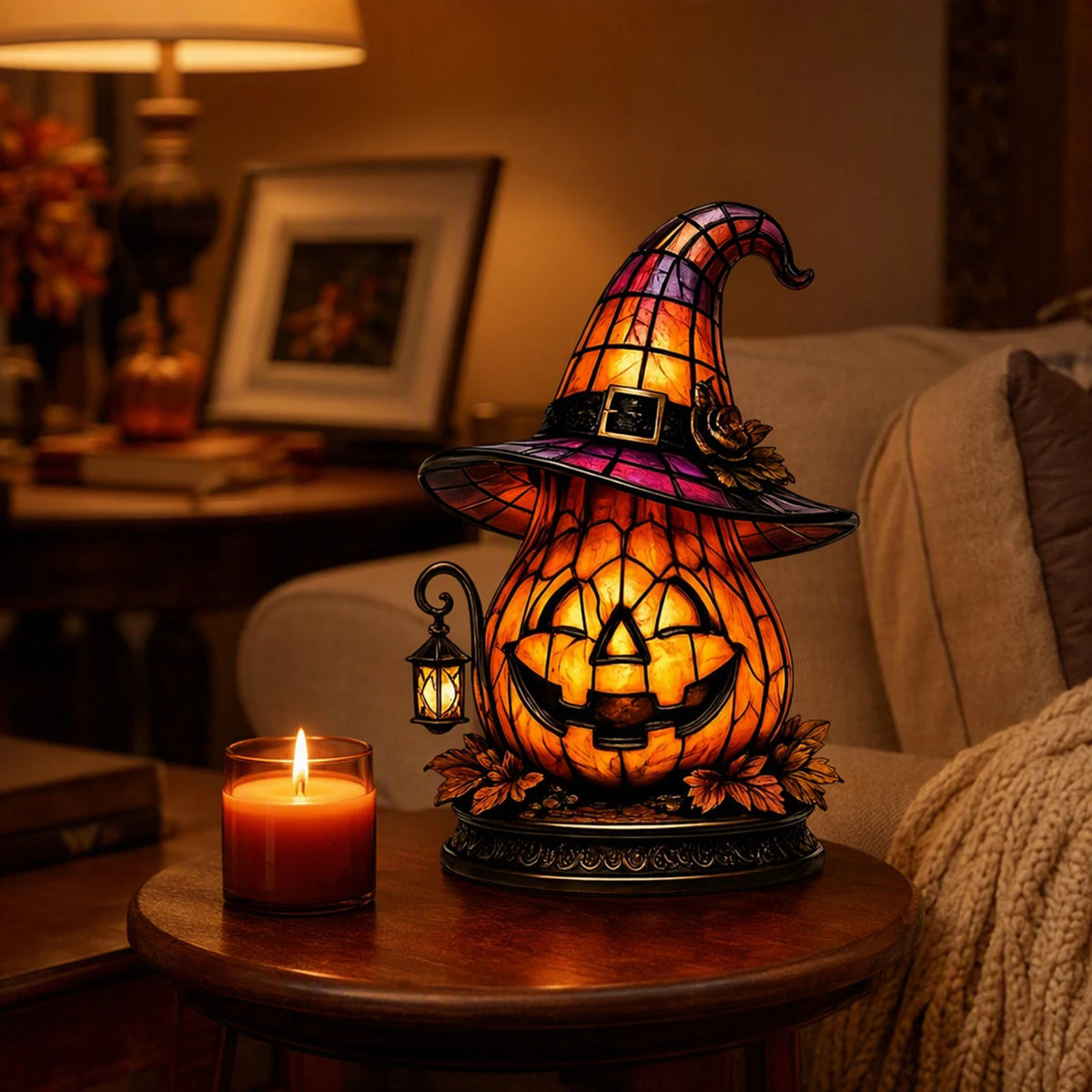 Witch hat pumpkin night light shown in a dark room