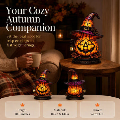 Witch hat pumpkin lamp lit on a bedside table