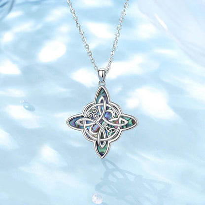 Sterling silver Witch Knot pendant with iridescent abalone shell inlay on an 18-inch chain.