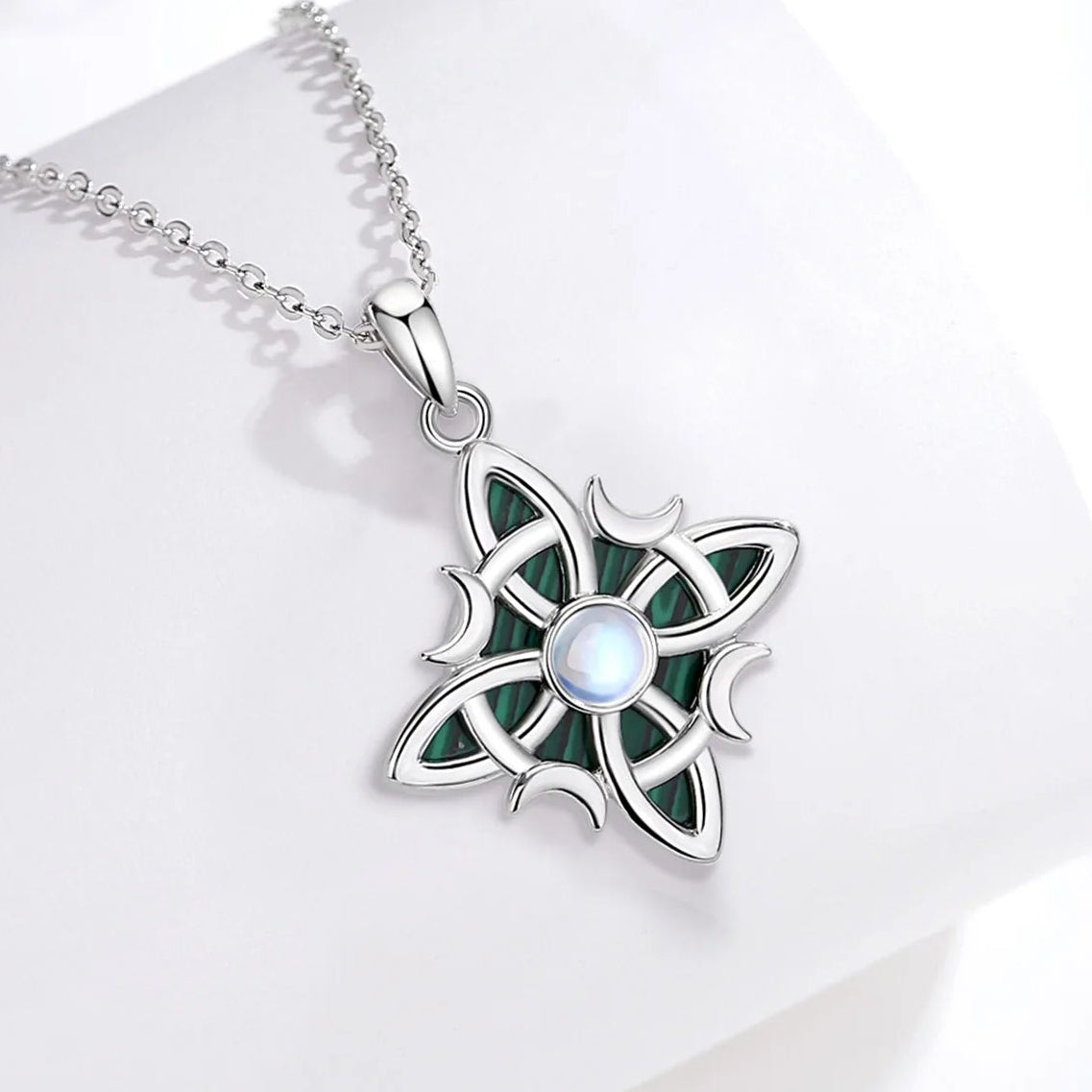 Alternate view of knot necklace: Witch Knot Necklace in 925 Sterling Silver, featuring an interwoven witch knot, malachite detail and an artificial moonstone center.