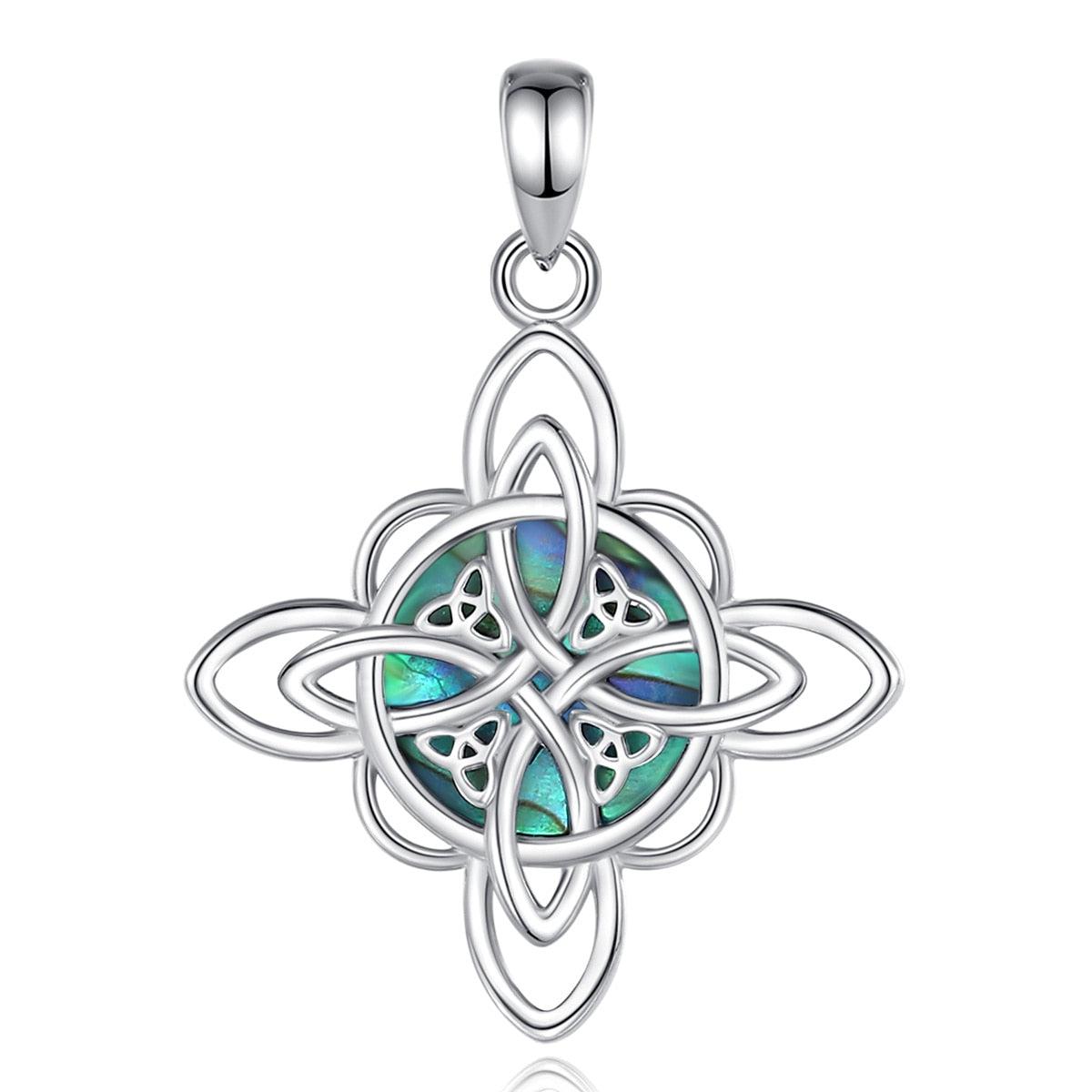 Sterling silver Witch Knot pendant with iridescent abalone shell, symbolizing protection and balance.