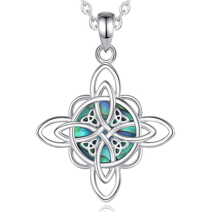 Sterling silver Witch Knot necklace with an iridescent abalone shell center, symbolizing protection and balance.
