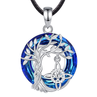 Sterling silver Witch Knot Tree of Life amulet necklace with a vibrant blue crystal and black cord.