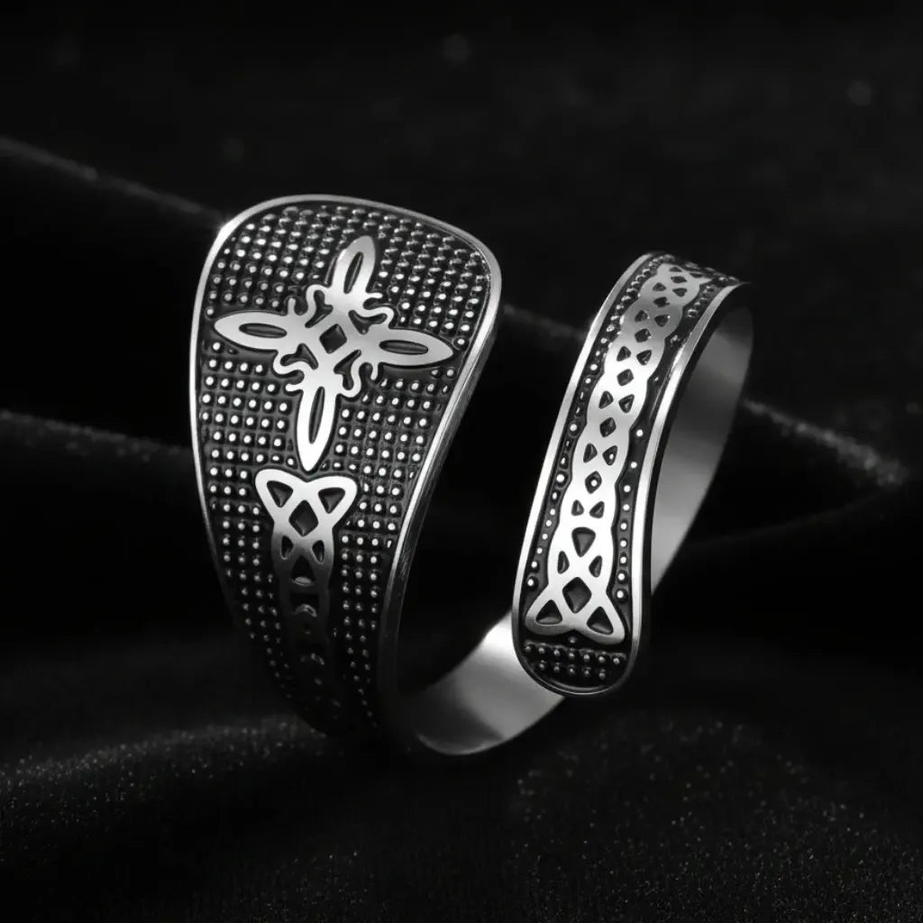 Silver Witch Knot open ring with Celtic trinity and endless knot design, close-up on black background