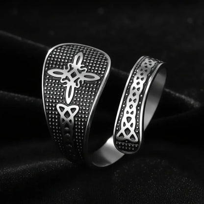 Silver Witch Knot open ring with Celtic trinity and endless knot design, close-up on black background