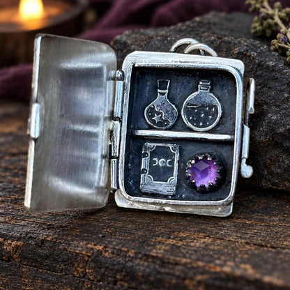 Hinged potion locket pendant opening to reveal tiny potion bottles, spellbook and amethyst - witch jewelry