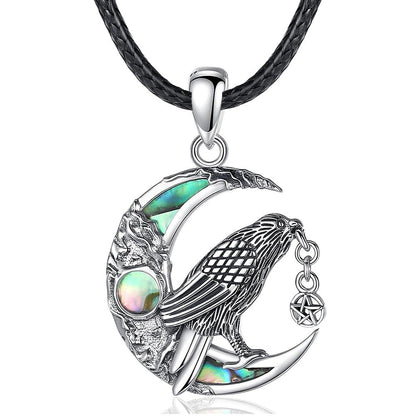 Witchy Raven Moon Necklace: 925 sterling silver raven on an abalone shell crescent moon, 30.5x20mm, black cord.