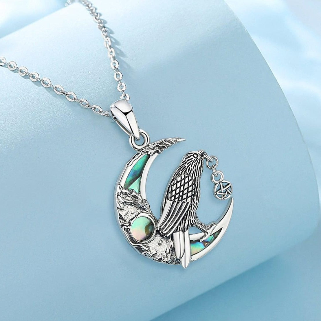 Witchy Raven Moon Necklace: 925 sterling silver raven on an abalone shell crescent moon, 30.5x20mm.