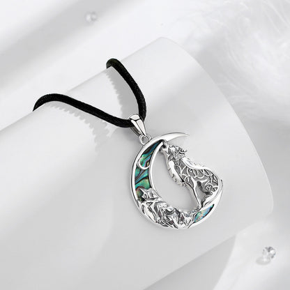 Enchanting 925 Sterling Silver Witchy Wolf Moon Necklace with iridescent abalone inlay on a black rope chain.