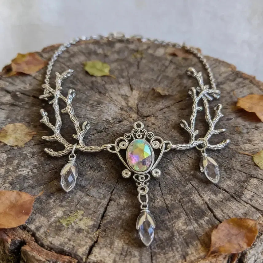 Branch twig crystal choker necklace close-up on dark background – nature magic Pagan jewelry
