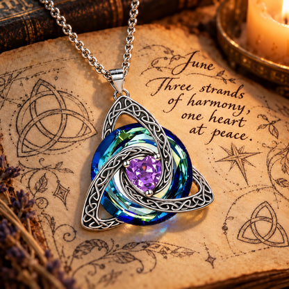 June Celtic Trinity Knot Birthstone Necklace on parchment — Three strands of harmony, one heart at peace.