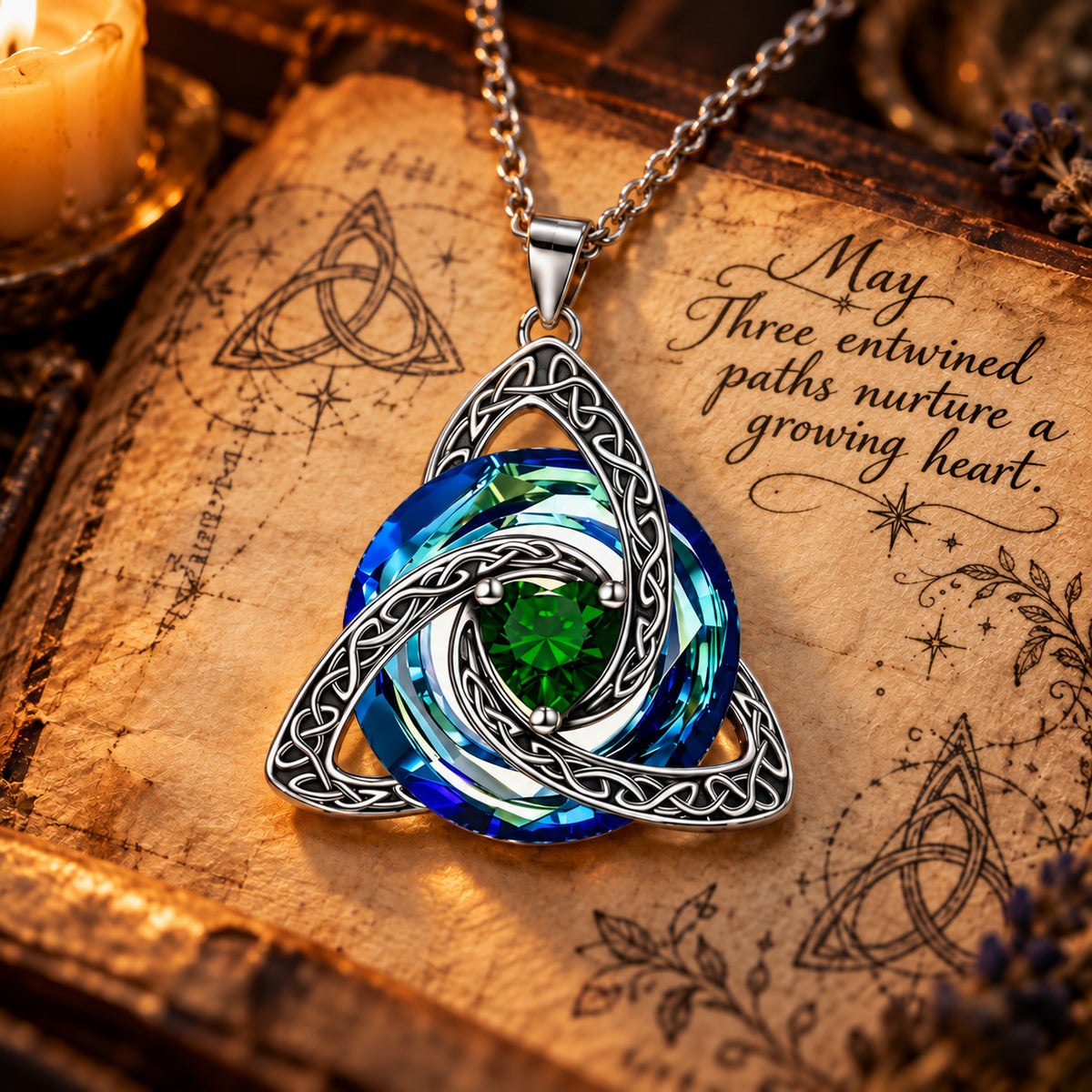 May Celtic Trinity Knot Birthstone Necklace on parchment — Three entwined paths nurture a growing heart.