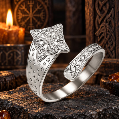 Celtic Witch Knot Ring with Triquetra & Rune Wheel Engraving in a dark pagan Viking altar setting, detailed polished metal finish