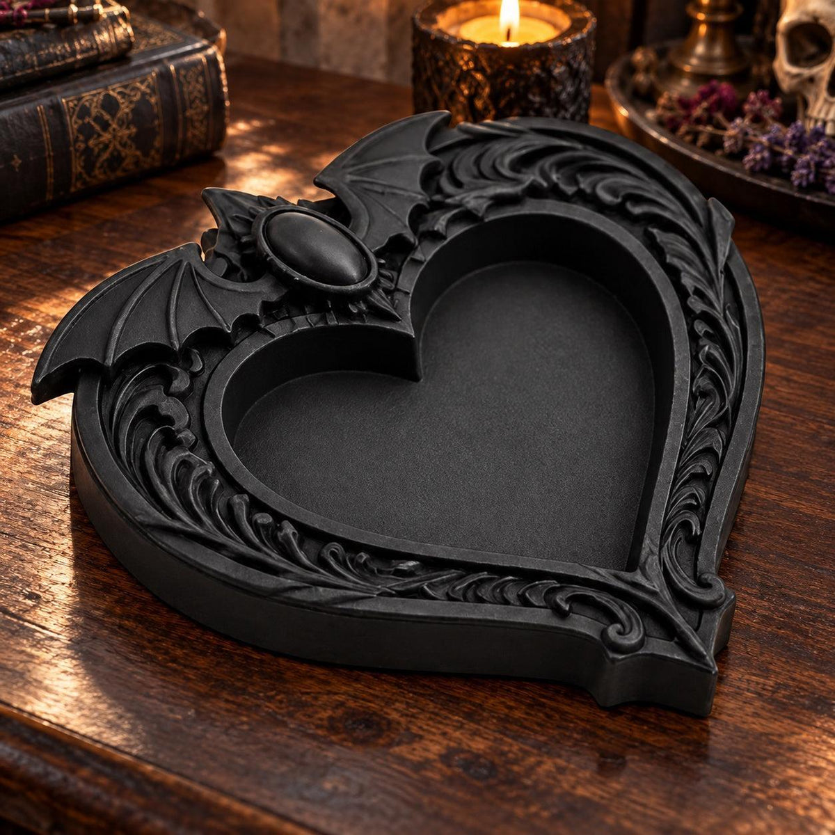 Side angle of the raised rim: Gothic Bat Wing Heart Jewelry Tray, featuring a heart-shaped center, outstretched bat wings and ornate raised scrollwork.