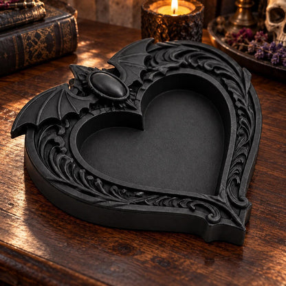Side angle of the raised rim: Gothic Bat Wing Heart Jewelry Tray, featuring a heart-shaped center, outstretched bat wings and ornate raised scrollwork.