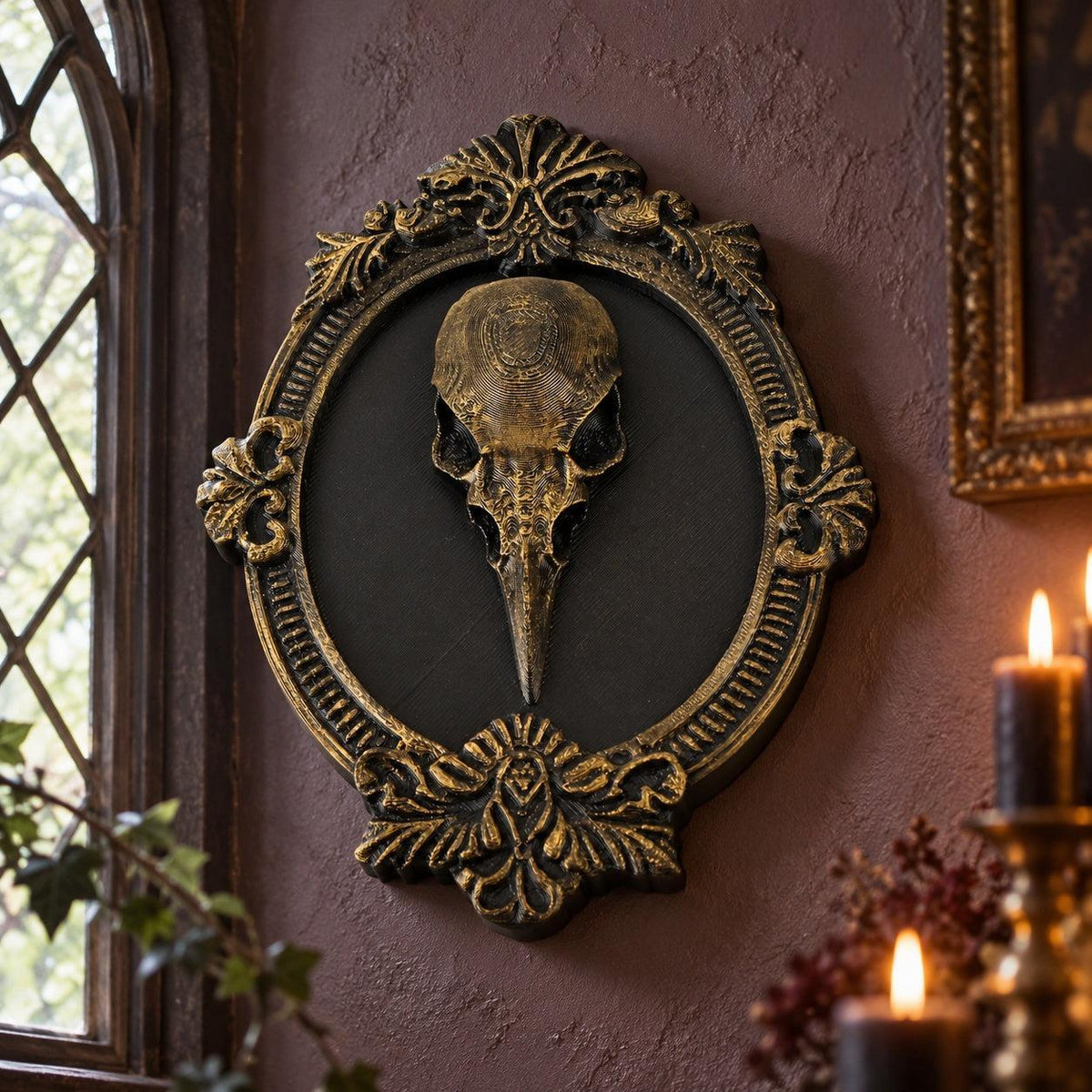 Front view of skull and ornamental frame: Gothic Raven Skull Wall Plaque, featuring a raven skull relief surrounded by an elaborate oval frame.