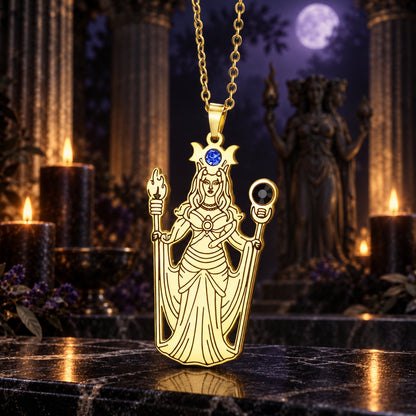 Greek Hecate Goddess Pendant Necklace in Stainless Steel in a dark Greek goddess altar setting, detailed polished metal finish