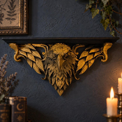 Ornate Eagle Head Wall Shelf in a realistic gothic room, front view with gold relief details and natural shadows.