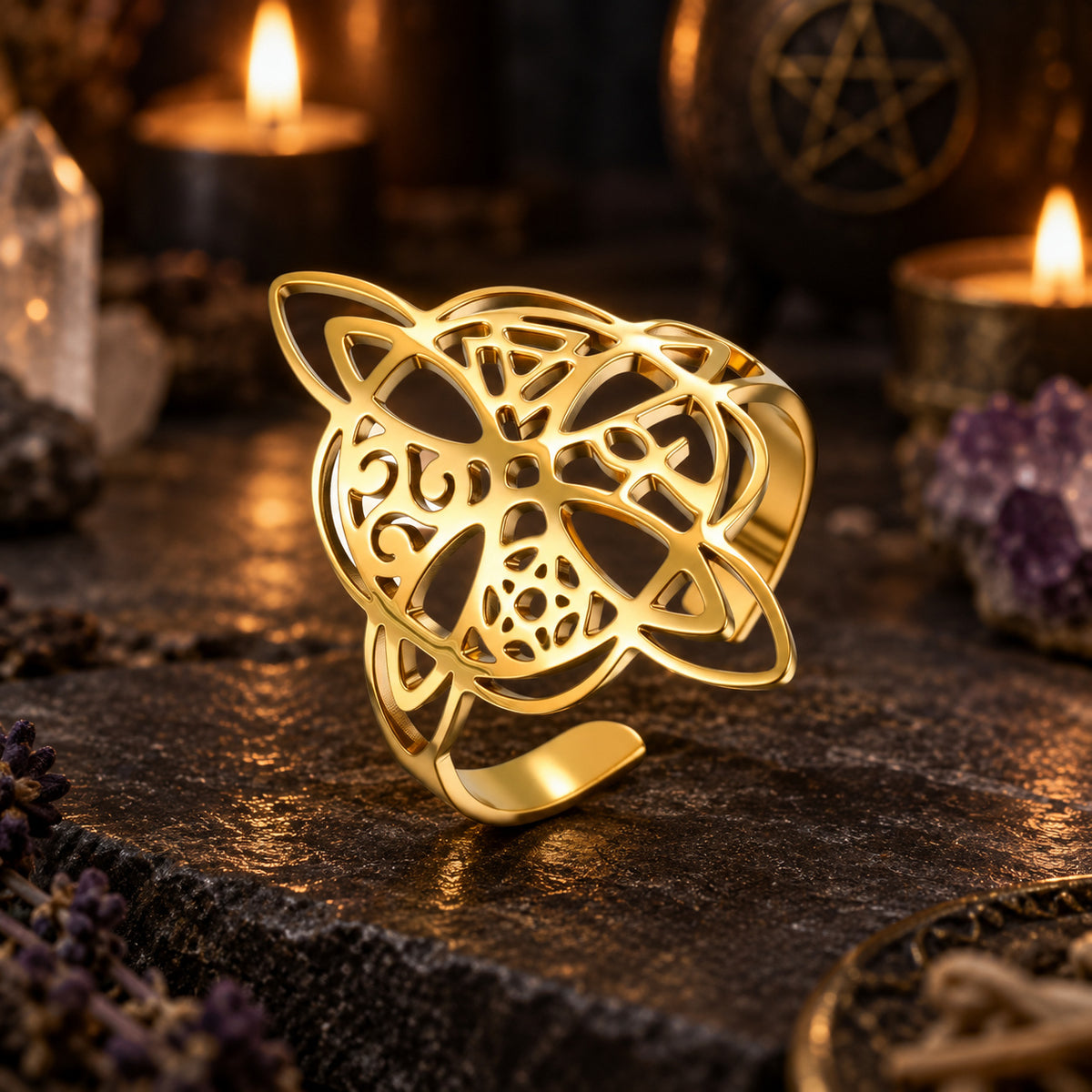 Gold witch knot ring with polished openwork symbols.