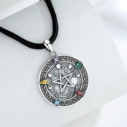 Sterling silver Moon phase Pentacle Necklace with colorful gemstones on a black cord.
