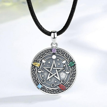 Sterling silver Moon phase Pentacle Necklace with colorful gemstones on a black cord.