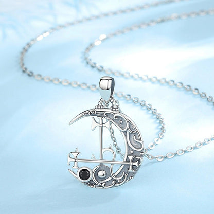 Sterling silver Lilith Moon necklace with intricate sigil design, black gemstone, and delicate chain.