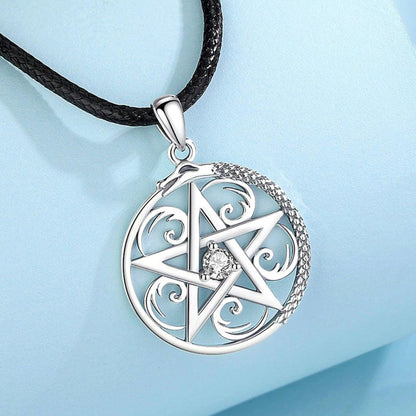Sterling silver pentacle necklace with a sparkling center stone and intricate snake design on a black cord.