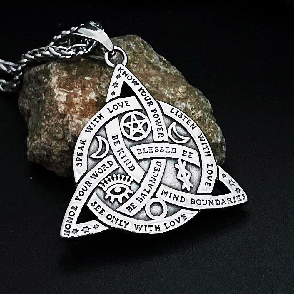 Silver Triquetra Celtic Knot Necklace with Wiccan symbols and empowering inscriptions, perfect for mystical fashion.